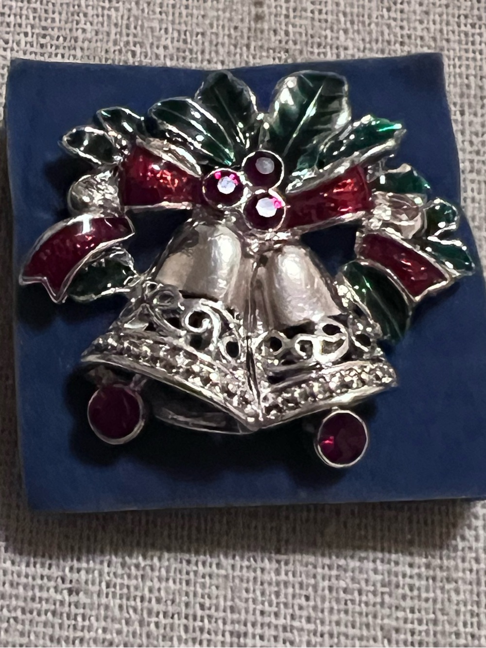 Vintage Avon silver-tone Christmas bells brooch.